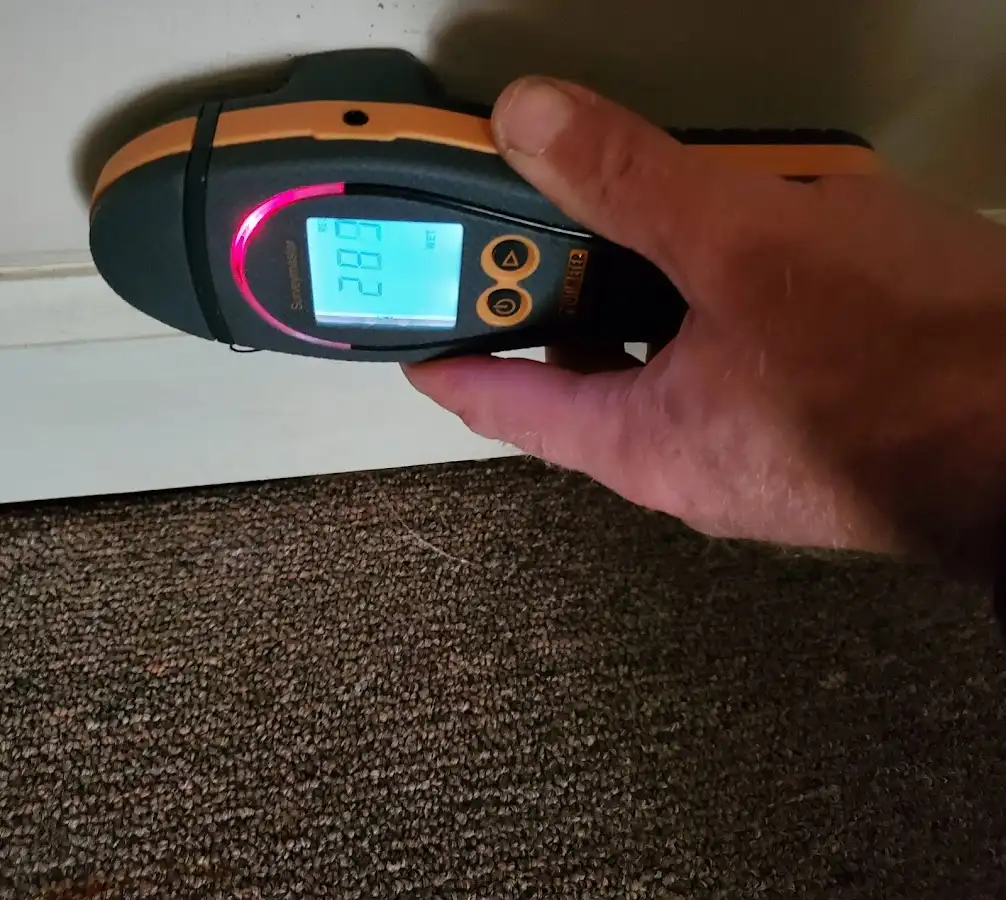 Moisture detection at baseboard during Storm Damage Restoration in Monterey Park